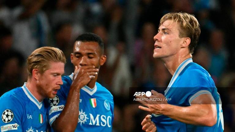 Napoli's Danish forward #19 Rasmus Hojlund celebrates scoring his team's first goal during the UEFA Champions League phase 2 football match Napoli vs Sporting Lisbon at the Diego Armando Maradona stadium in Naples on October 1, 2025. - AFP