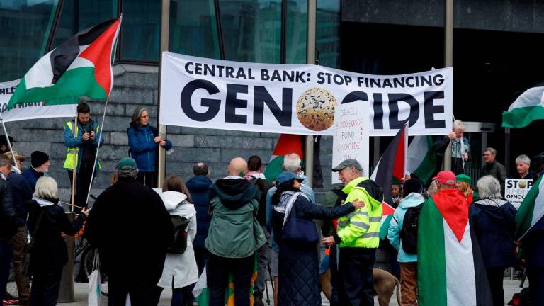 People in support of Palestinians demonstrate outside the Central Bank of Ireland against the sale of Israeli war bonds throughout the EU, in Dublin, Ireland, May 27, 2025. REUTERSpix