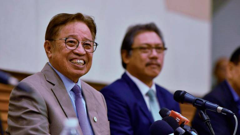 Sarawak Premier Tan Sri Abang Johari Tun Openg (left) speaks to reporters during a press conference at the Launch of the Sarawak Energy Transition Policy (SET-P) at the Borneo Convention Centre Kuching (BCCK) today. – BERNAMA
