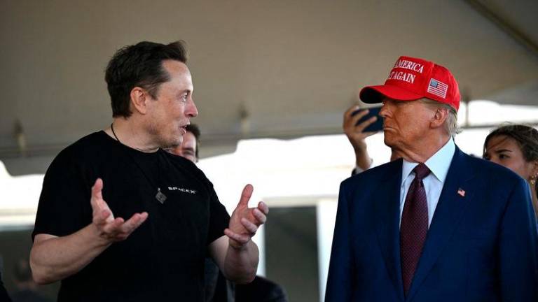 US President Donald Trump (right) and Elon Musk - Photo by AFP
