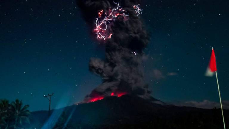 This handout photo taken and released on August 1, 2025 by Indonesia's Geological Agency shows Mount Lewotobi Laki-Laki spewing lava and volcanic ash up to approximately 10 kilometres high during its eruption as observed from the monitoring post in East Flores, in East Nusa Tenggara province. - AFPPIX/ INDONESIA'S GEOLOGICAL AGENCY