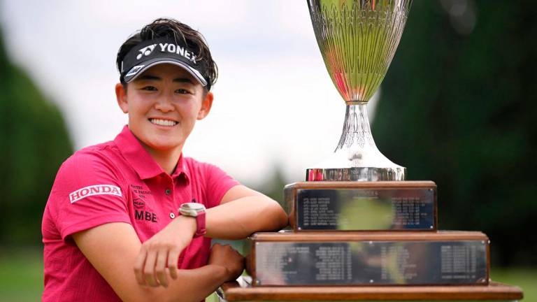 Akie Iwai of Japan poses with the trophy after winning The Standard Portland Classic 2025 at Columbia Edgewater Country Club on August 17, 2025 in Portland, Oregon. - Orlando Ramirez/Getty Images/AFP