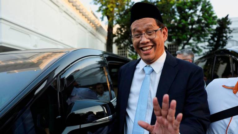 Indonesia’s newly appointed Finance Minister Purbaya Yudhi Sadewa waves to journalists following his inauguration at the Presidential Palace in Jakarta, Indonesia, September 8, 2025. REUTERS/Willy Kurniawan