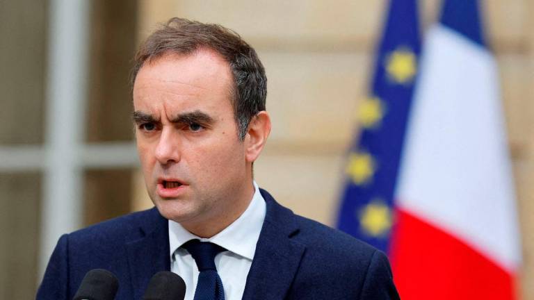French outgoing Prime Minister Sebastien Lecornu gives a statement on the sidelines of his talks with political parties’ leaders in a bid to form a coalition government, able to pass an austerity budget through parliament, at the Hotel Matignon in Paris on October 8, 2025. (Photo by Stephanie Lecocq / POOL / AFP)