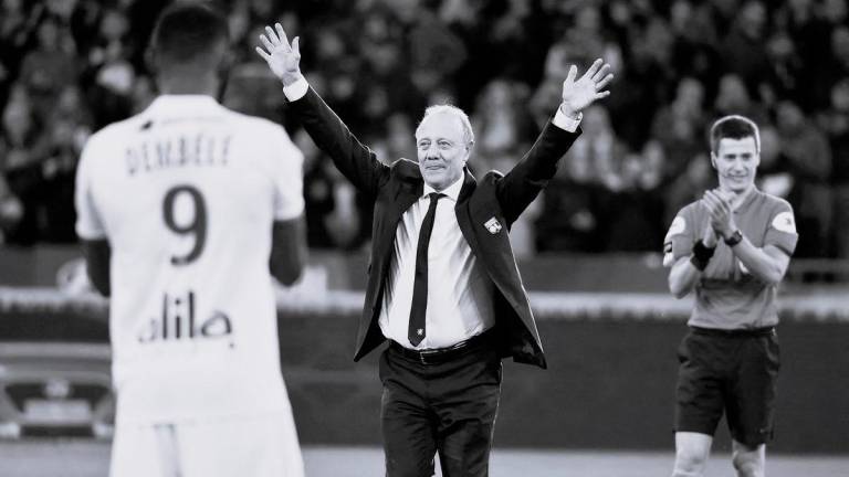Special advisor to Lyon's president, former player Bernard Lacombe (C) celebrates his retirement on the pitch ahead of the French L1 football match between Olympique Lyonnais and Stade Rennais Football Club at the Groupama stadium in Decines-Charpieu near Lyon, central eastern France on December 15, 2019. - AFPPIX