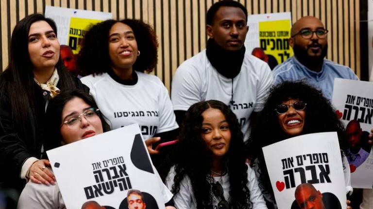 Friends and supporters react to the release of Avera Mengistu, who entered Gaza independently around a decade ago and has been held there since, on the day of the release of six hostages from captivity in Gaza as part of hostages-prisoners swap and a ceasefire deal between Hamas and Israel, in Ashkelon - REUTERSpix