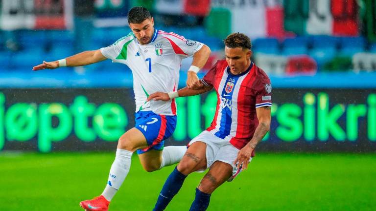 Riccardo Orsolini in action with Norway’s Antonio Nusa Lise Aserud/NTB via REUTERS