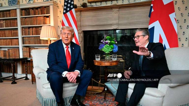 Britain's Prime Minister Keir Starmer and US President Donald Trump sit down for a bilateral meeting at Chequers, in Aylesbury, central England, on September 18, 2025, on the second day of the US President's second State Visit. - AFP