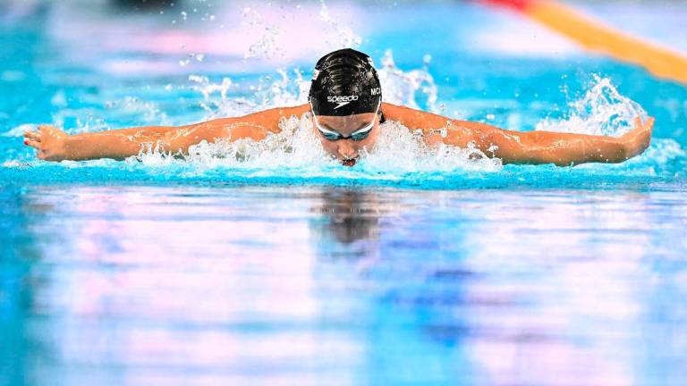 Canada’s swimmer Summer Mcintosh competes in a heat of the women’s 200m individual medley swimming event during the 2025 World Aquatics Championships in Singapore on July 27, 2025- Photo by MANAN VATSYAYANA / AFP