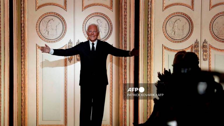 Italian fashion designer Giorgio Armani acknowledges the audience at the end of the 2017-2018 fall/winter Haute Couture collection in Paris on July 4, 2017. - AFP