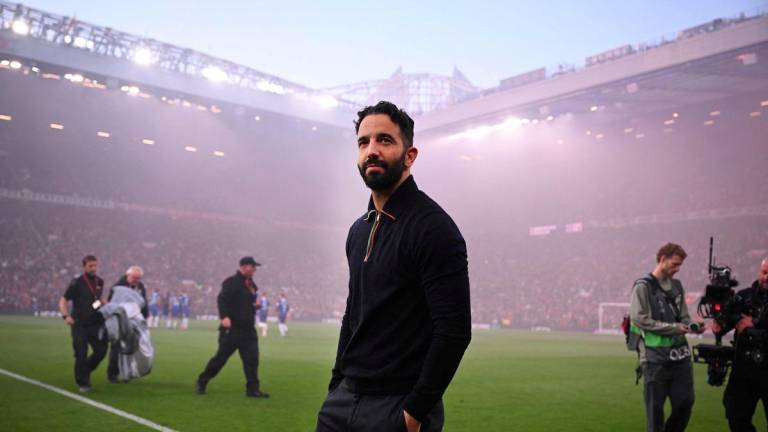 Manchester United's Portuguese head coach Ruben Amorim (C) looks on ahead of the UEFA Europa League semi final second leg football match between Manchester United and Athletic Club Bilbao at Old Trafford stadium in Manchester, north west England, on May 8, 2025. - AFPPIX