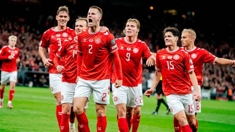 Denmark’s Joachim Andersen celebrates scoring their second goal with teammates Mads Claus. - Rasmussen/Ritzau Scanpix via REUTERS