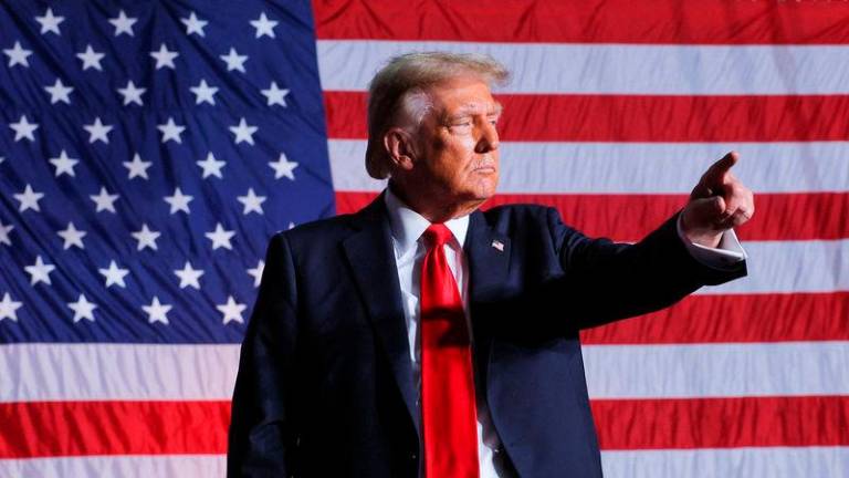 Republican presidential nominee and former U.S. President Donald Trump gestures on the day of a campaign rally in Greensboro, North Carolina - REUTERSpix