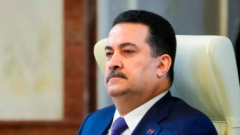 Iraq’s Prime Minister Mohammed Shia al-Sudani attends the 34th Arab League summit in Baghdad on May 17, 2025. (Photo by Hadi Mizban / POOL / AFP)