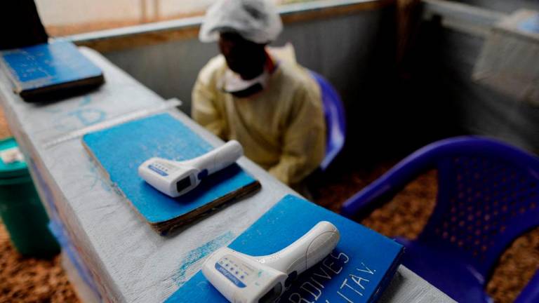 FILE PHOTO: Thermometers are pictured at the entrance of an Ebola Treatment Centre in the Eastern Congolese town of Butembo in the Democratic Republic of Congo, October 4, 2019. REUTERS/Zohra Bensemra/File Photo
