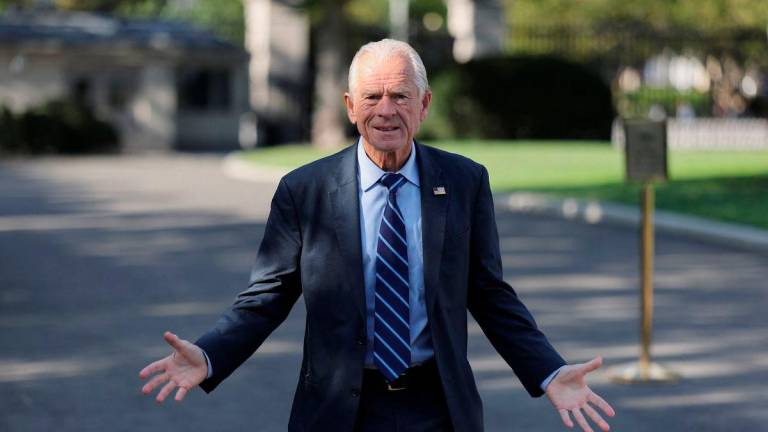 White House trade advisor Peter Navarro speaks to photographers on the West Wing driveway at the White House in Washington, D.C., U.S., August 28, 2025. REUTERS/Jonathan Ernst