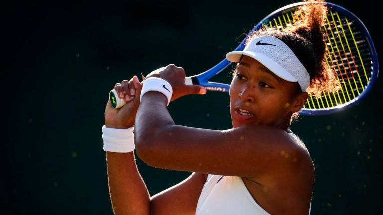 Japan’s Naomi Osaka reacts as she plays against Czech Republic’s Katerina Siniakova during their women’s singles second round tennis match on the third day of the 2025 Wimbledon Championships at The All England Lawn Tennis and Croquet Club in Wimbledon, southwest London, on July 2, 2025- AFP