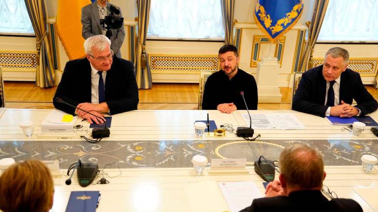 Danish Foreign Minister Lars Loekke Rasmussen sits for a meeting with Ukrainian President Volodymyr Zelenskiy and Foreign Minister Andrii Sybiha during a visit to Kyiv, Ukraine, September 12, 2025. Ritzau Scanpix/Mads Claus Rasmusse via REUTERS