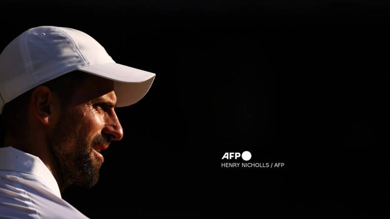 Serbia's Novak Djokovic looks on as he plays against Italy's Jannik Sinner during their men's singles semi-final tennis match on the twelfth day of the 2025 Wimbledon Championships at The All England Lawn Tennis and Croquet Club in Wimbledon, southwest London, on July 11, 2025. - AFP