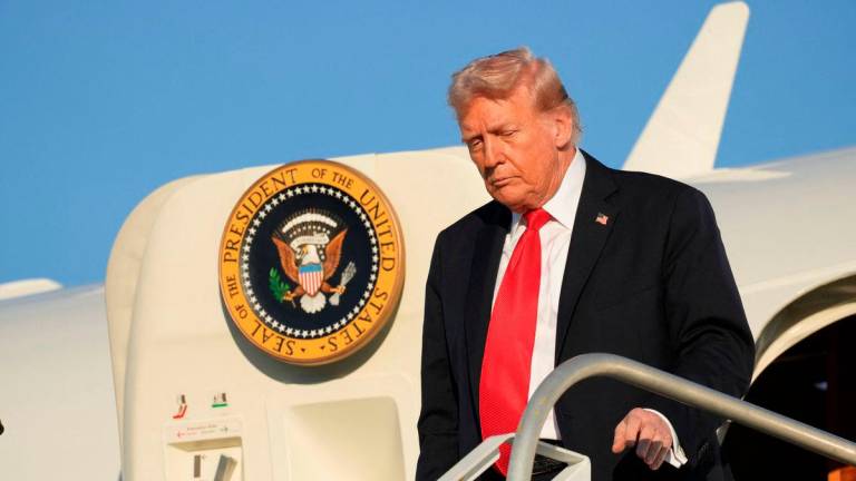 U.S. President Donald Trump steps off Air Force One at LaGuardia Airport in New York, U.S., September 11, 2025. REUTERS/Ken Cedeno