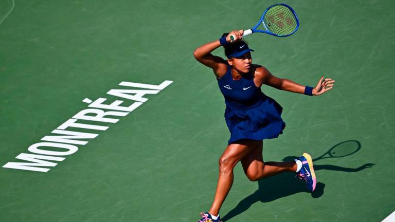 Naomi Osaka of Japan plays a forehand against Ariana Arseneault of Canada during their first round match on Day Two of the WTA 1000 National Bank Open at IGA Stadium on July 28, 2025 in Montreal, Quebec, Canada. - AFPPIX