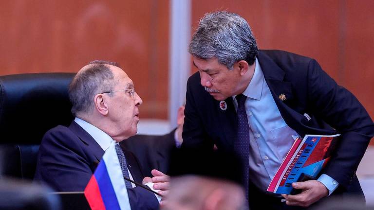 Malaysia’s Foreign Minister, Datuk Seri Mohamad Hasan, engages in conversation with Russia’s Foreign Minister, Sergey Lavrov, at the ASEAN Post-Ministerial Conference with Japan, in conjunction with the 58th ASEAN Foreign Ministers’ Meeting and related meetings at the Kuala Lumpur Convention Centre today - BERNAMA
