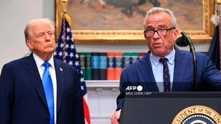 (L/R) US President Donald Trump looks on as US Secretary of Health and Human Services Robert F. Kennedy Jr. speaks during an event about autism in the Roosevelt Room of the White House in Washington, DC on September 22, 2025. - AFP