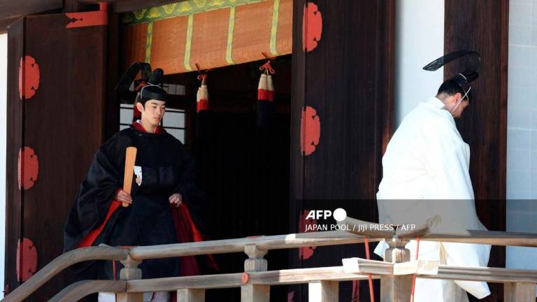Japan’s Prince Hisahito (L) attends his coming-of-age ceremony at the Imperial Palace in Tokyo on September 6, 2025. - JAPAN POOL / JIJI PRESS / AFP