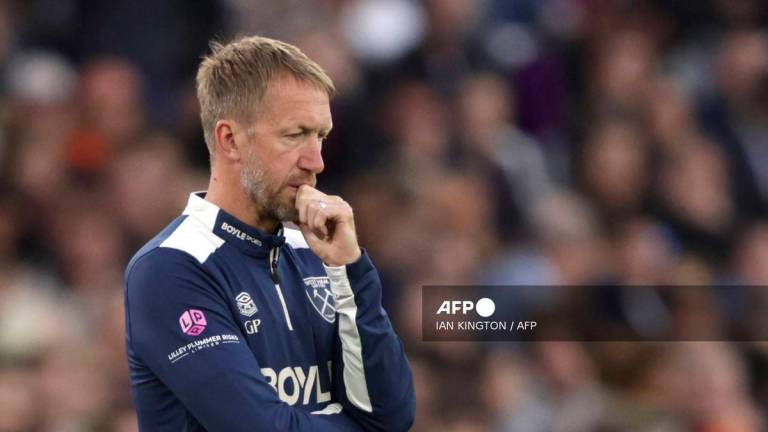 West Ham United's English head coach Graham Potter looks on the touchline withe the score at 0-3 in the second half during the English Premier League football match between West Ham United and Tottenham Hotspur at the London Stadium, in London on September 13, 2025. - AFP