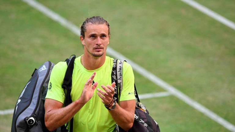 Germany's Alexander Zverev reacts at the end of his tennis match against Italy's Lorenzo Sonego during the Halle Open ATP tennis tournament in Halle, on June 19, 2025. - AFPPIX