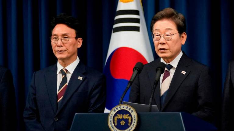 FILE PHOTO: South Korean President Lee Jae-myung speaks during a press conference with Kim Min-seok, appointed as Prime Minister, at the Presidential office in Seoul, South Korea, Wednesday, June 4, 2025. Ahn Young-joon/Pool via REUTERS/File Photo