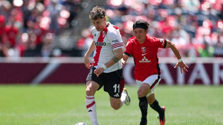 Facundo Colidio #11 of CA River Plate is challenged by Hirokazu Ishihara #4 of Urawa Red Diamonds during the FIFA Club World Cup 2025 group E match between CA River Plate and Urawa Red Diamonds at Lumen Field on June 17, 2025 in Seattle, Washington. - AFPPIX