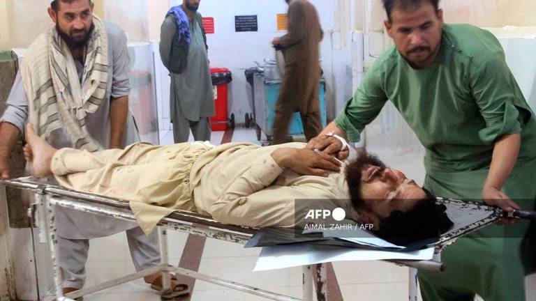Volunteers carry an injured man to a hospital after an earthquake in Afghanistan's Jalalabad on September 1, 2025. Nine people died when a 6.0-magnitude earthquake and powerful aftershock rattled eastern Afghanistan, the provincial Nangarhar government said on September 1. - Aimal ZAHIR / AFP