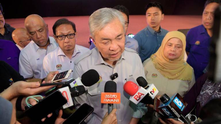 Deputy Prime Minister Datuk Seri Dr Ahmad Zahid Hamidi, who is also the Rural and Regional Development Minister, speaking to the media during the launch of the Perak State KEMAS Santunan Desa Programme with JPKK and the KEMAS Community at Dewan Besar Bandar Baru Felcra Seberang Perak here today. - BERNAMA