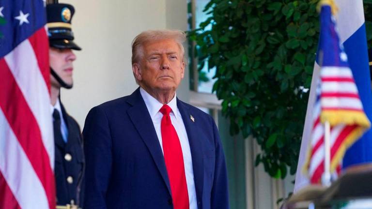 U.S. President Donald Trump looks on before welcoming Finland’s President Alexander Stubb at the White House in Washington, D.C., U.S., on October 9, 2025. REUTERS/Nathan Howard