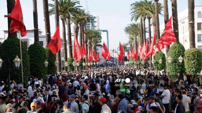 Crowds gather in front of the Moroccan Parliament headquarters in Rabat on October 10, 2025, as the King prepares to chair the opening of the 1st session of 5th legislative year. - AFP