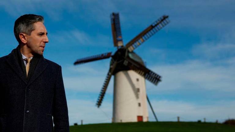 Taoiseach (Prime Minister) and leader of Fine Gael Simon Harris looks on as he canvasses ahead of a general election, in Skerries, Ireland November 21, 2024. - REUTERSPIX