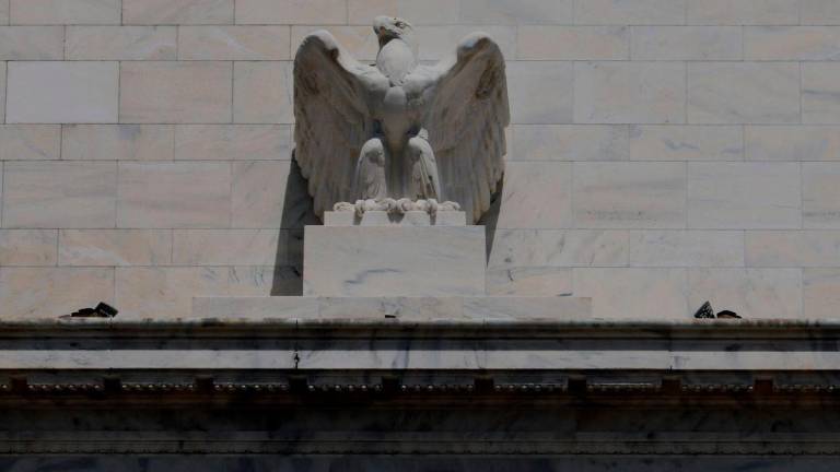 An eagle tops the U.S. Federal Reserve building's facade, as U.S. President Donald Trump said he was firing Federal Reserve Governor Lisa Cook over alleged improprieties in obtaining mortgage loans, in Washington, D.C., U.S., August 26, 2025. - REUTERSPIX