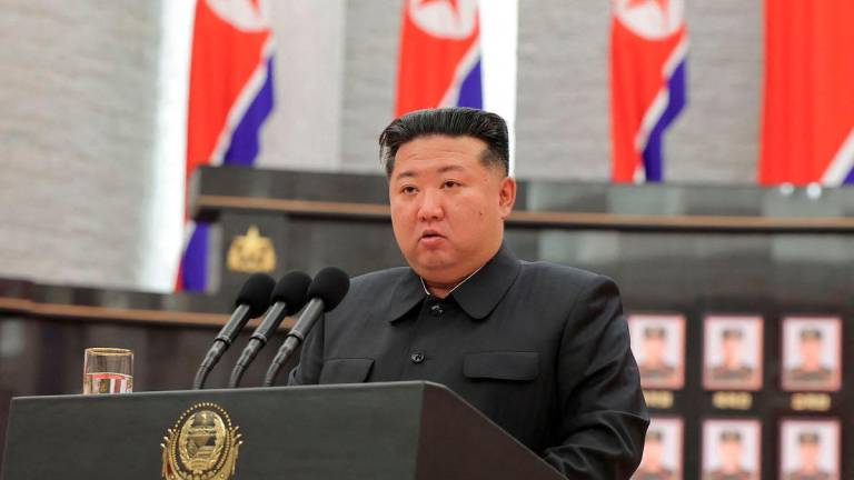 This undated picture released from North Korea's official Korean Central News Agency (KCNA) on August 22, 2025 shows North Korean leader Kim Jong Un speaking during a ceremony to award state commendations to the commander and combatants of the Korean People's Army's Overseas Operational Forces, who took part in military operations in Kursk Oblast of western Russia, at the headquarters building of the Central Committee of the The Workers' Party of Korea (WPK) in Pyongyang. - AFP PHOTO/KCNA VIA KNS