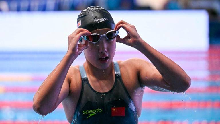 China’s swimmer Yu Zidi reacts after the final of the women’s 400m individual medley swimming event during the 2025 World Aquatics Championships in Singapore on August 3, 2025. Photo by Oli SCARFF / AFP