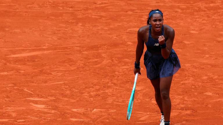 US Coco Gauff celebrates after winning against Russia’s Ekaterina Alexandrova at the end of their women’s singles match on day 9 of the French Open tennis tournament on Court Philippe-Chatrier at the Roland-Garros Complex in Paris on June 2, 2025. (Photo by Alain JOCARD / AFP)