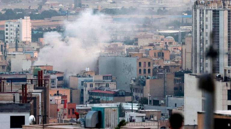 Smoke billows from an explosion in southwest Tehran on June 16, 2025. (Photo by ATTA KENARE / AFP)
