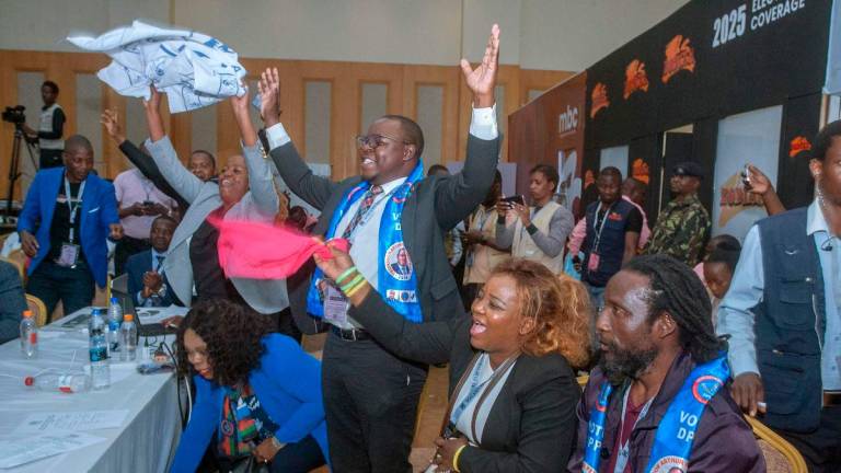 Democratic Progressive Party (DPP) celebrate at the National Tally Centre their win soon after the Chairperson of the Malawi Electoral Commission declared the party’s presidential candidate Peter Arthur Mutharika and his running mate Justice Jane Ansah as President elect and Vice President elect, in Lilongwe on September 24, 2025. (Photo by Amos GUMULIRA / AFP)