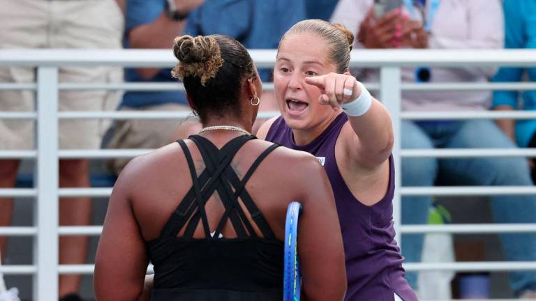 Jelena Ostapenko of Latvia (R) argues with Taylor Townsend of the United States (L) following their Women's Singles Second Round match on Day Four of the 2025 US Open at USTA Billie Jean King National Tennis Center on August 27, 2025 in the Flushing neighborhood of the Queens borough of New York City. - Clive Brunskill/Getty Images/AFPPIX