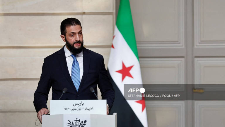 Syrian President Ahmed al-Sharaa speaks during a joint press conference with French President after a meeting at the Elysee Palace in Paris, on May 7, 2025. - POOL / AFP