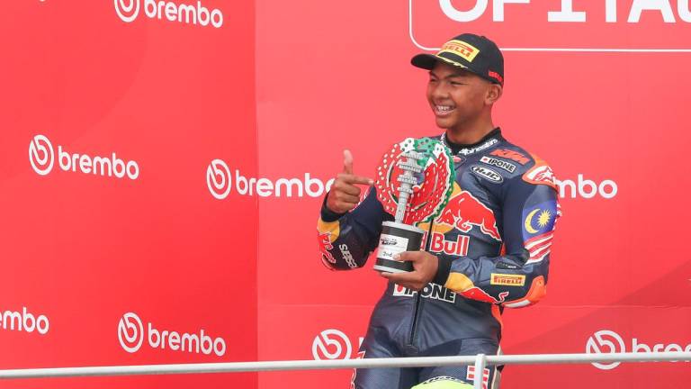 Hakim Danish celebrating his podium during the Italian RedBull Rookies Cup