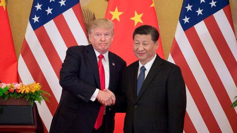 Donald Trump and Xi Jinping. Photo: Nicolas Asfouri/AFP/Getty Images