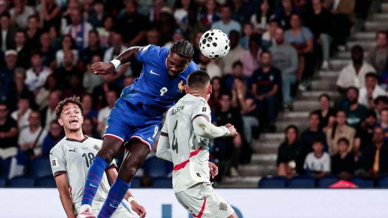 France's forward #09 Marcus Thuram (C) heads the ball flanked by Iceland's defender #04 Victor Palsson (R) and Iceland's midfielder #18 Mikael Anderson (L) during the FIFA World Cup 2026 Group D European qualification football match between France and Iceland at the Parc des Princes stadium in Paris, on September 9, 2025. - AFPPIX
