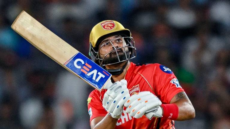 Punjab Kings’ captain Shreyas Iyer watches the ball after playing a shot during the Indian Premier League (IPL) Twenty20 second Qualifier cricket match between Punjab Kings and Mumbai Indians at the Narendra Modi Stadium in Ahmedabad on June 2, 2025. (Photo by Arun SANKAR / AFP) / -
