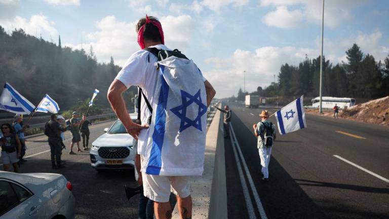 Demonstrators block Israel's main highway connecting Jerusalem and Tel Aviv, after families of hostages have called for a nationwide strike to demand the return of all hostages and an end to the war in Gaza, Latrun Israel August 17,2025 - REUTERSPIX
